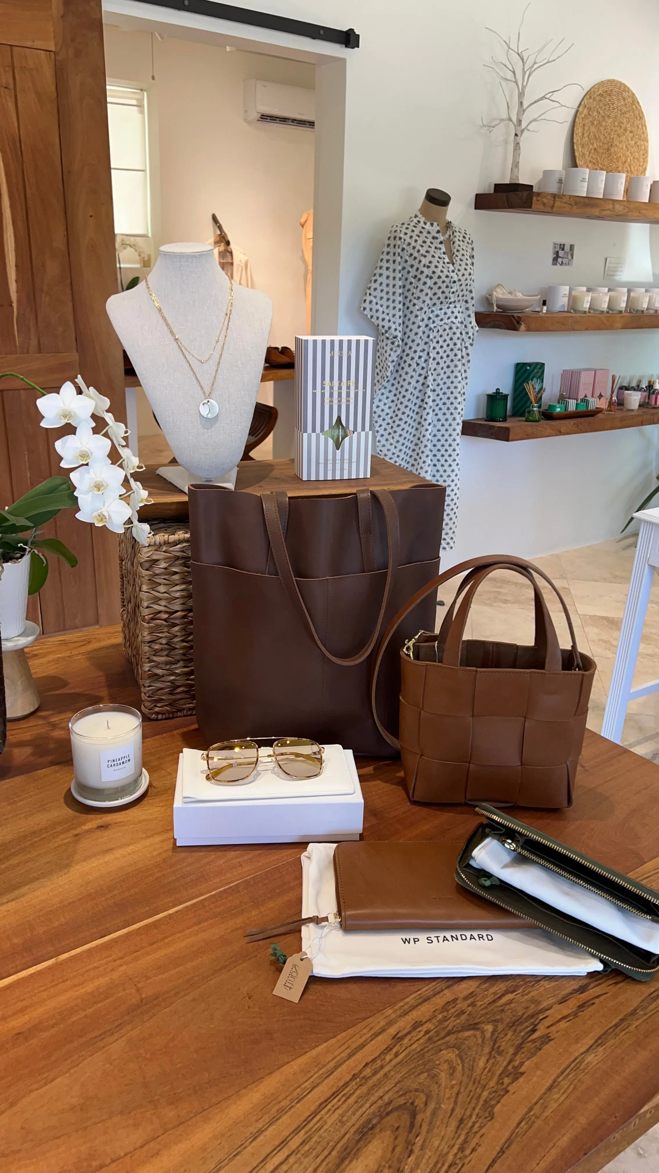 Handcrafted Petite woven leather tote with crossbody strap.