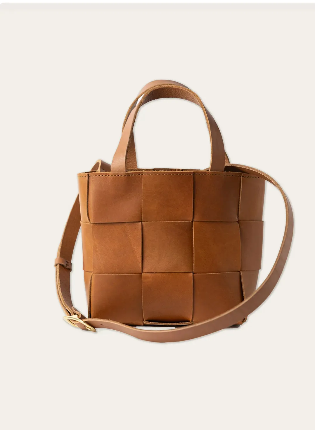 Handcrafted Petite woven leather tote with crossbody strap.