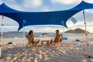 Nomad Beach Shade | 9x8.5 ft. Beach Tent Sun Shelter with UPF50  Protection, Adjustable Shade Tent | Quick 5-Min Setup, 25 MPH Windproof, Light & Compact, Works on Grass & Sand | 4-Posts